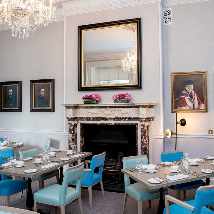 Fireplace with a large mirror above it in the 1592 restaurant