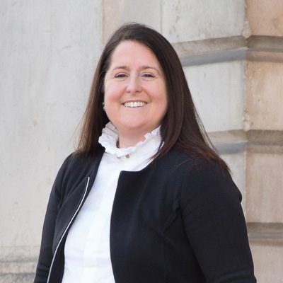 woman in black jacket smiling