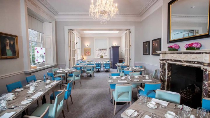 Inside the 1592 restaurant, with laid out tables and chairs