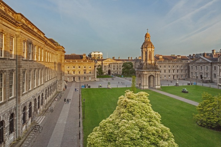 Green trees and the sun shining on Trinity College Dublin