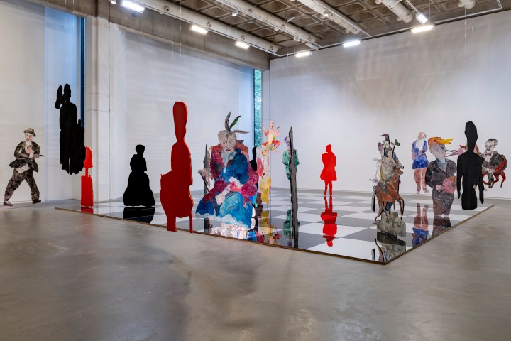 An installation of a giant chess board with colourful pieces in the Douglas Hyde Art Gallery in Trinity College.