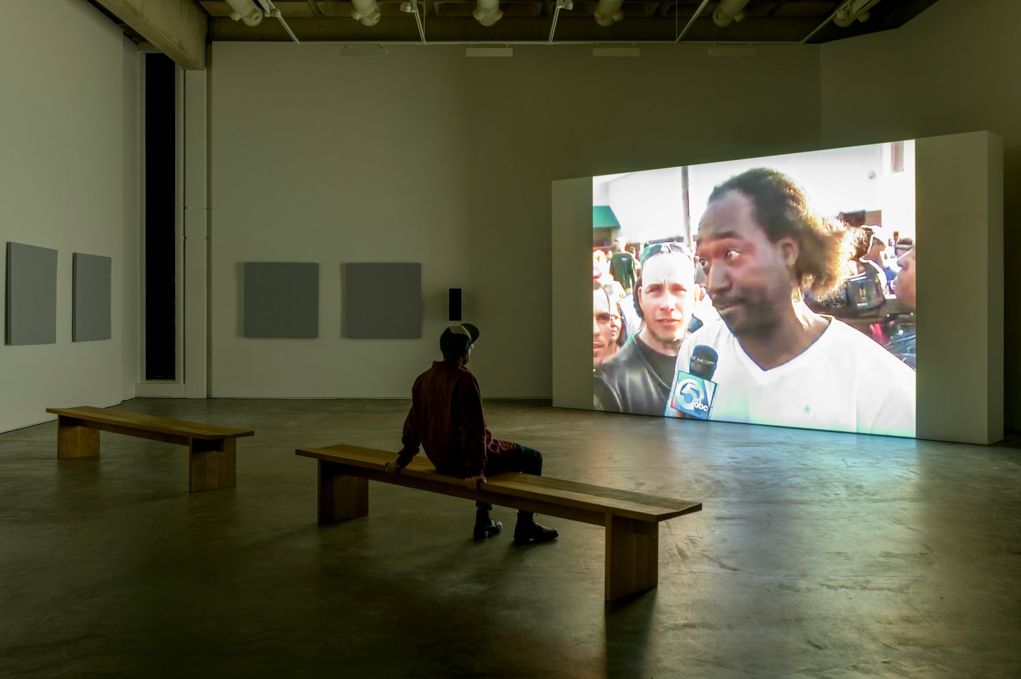 A mad watches a display at the Douglas Hyde Gallery of Contemporary Art