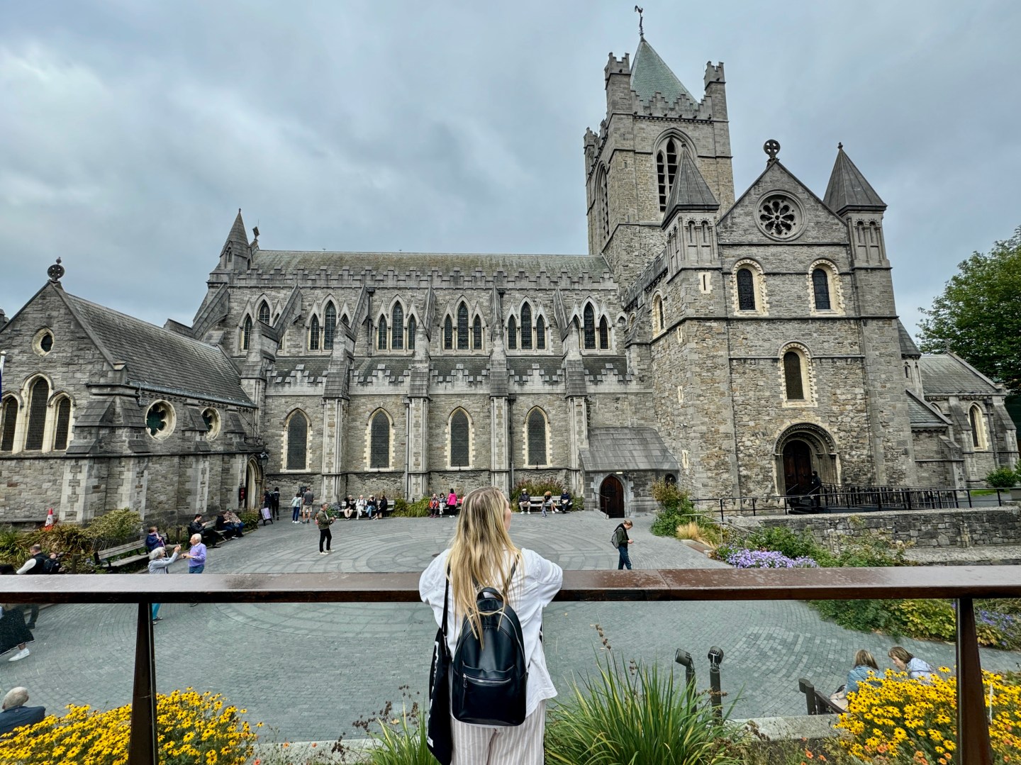 A woman looking at the exterior of Christ Church