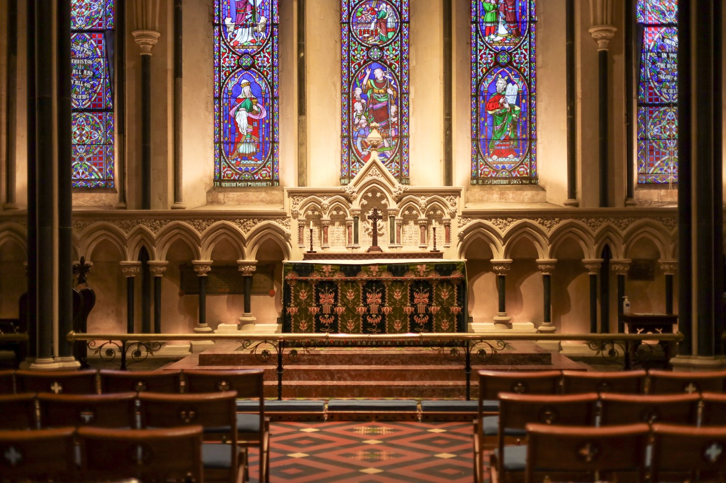 St Patrick's Cathedral, with an alter and stain-glass windows in the background