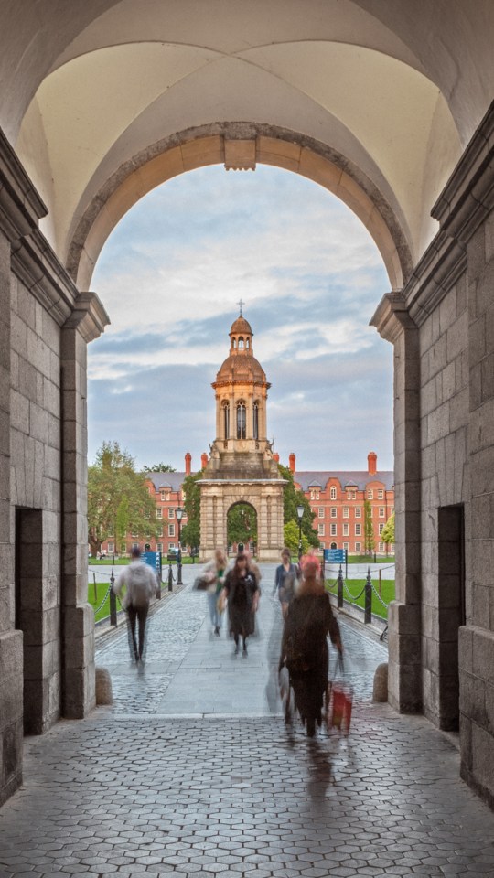 People walking through Trinity College Dublin