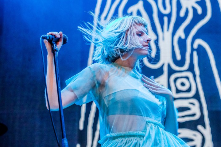 Singer Aurora performing on stage at the 2025 Summer Series at Trinity College Dublin